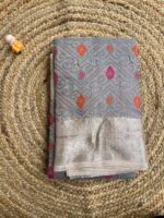 Grey Crush Organza Saree with Silver Zari Border and Multicolor Butta Weaves