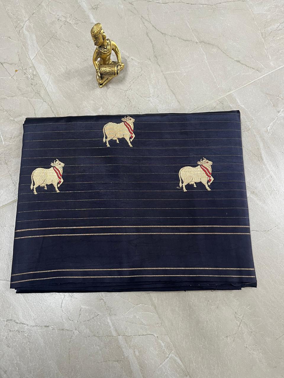 WhatsApp Image 2026-01-28 at 10.56.19 AM (1) Raw Mango Silk Saree in Classic Navy Blue with Gold Cow Motifs - Image 1