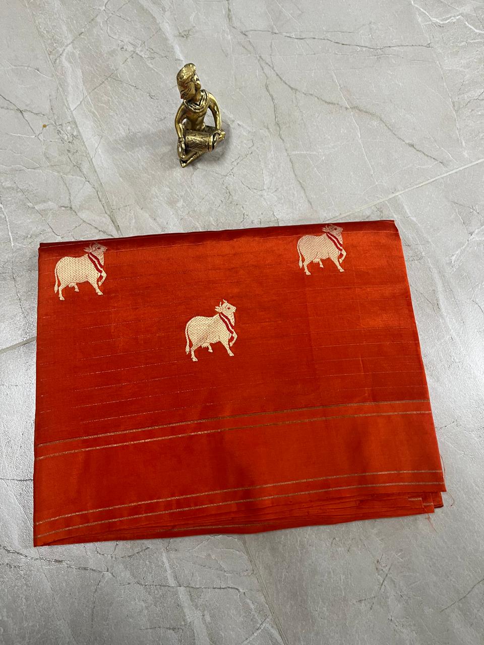 WhatsApp Image 2026-01-28 at 10.56.19 AM (3) Raw Mango Silk Saree in Rust Orange with Gold Cow Motifs - Image 1
