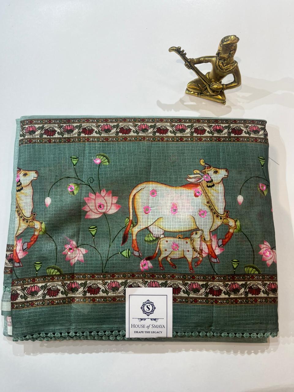 WhatsApp Image 2026-01-31 at 8.20.42 PM Green Kora Cotton Saree with Cow Motif & Floral Border - Image 1